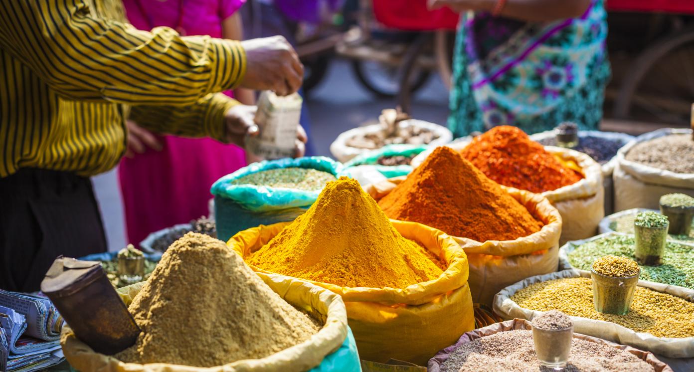 Colorful spices powders and herbs in traditional street market in Delhi. India.