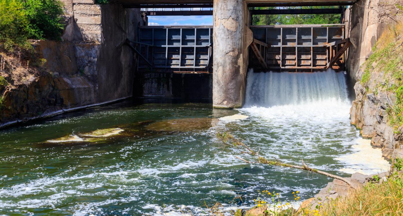 Open sluice gates of a small dam