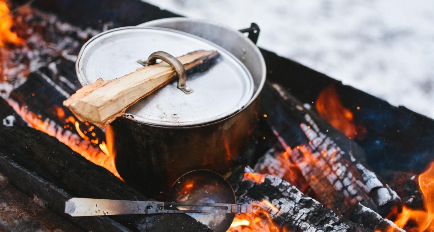 Silver cook pot on a stove