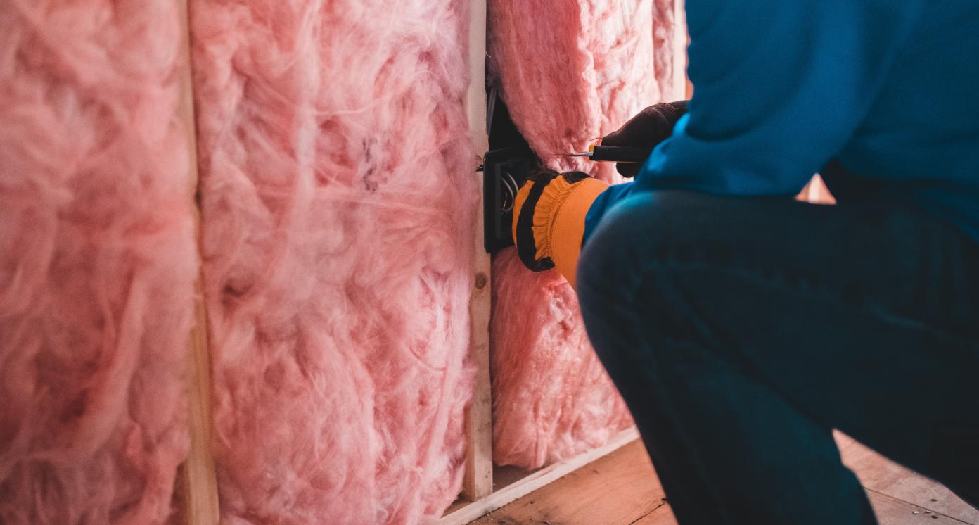 worker insulating building