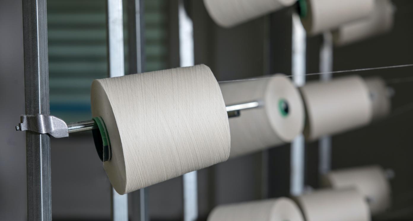 White thread on a power loom