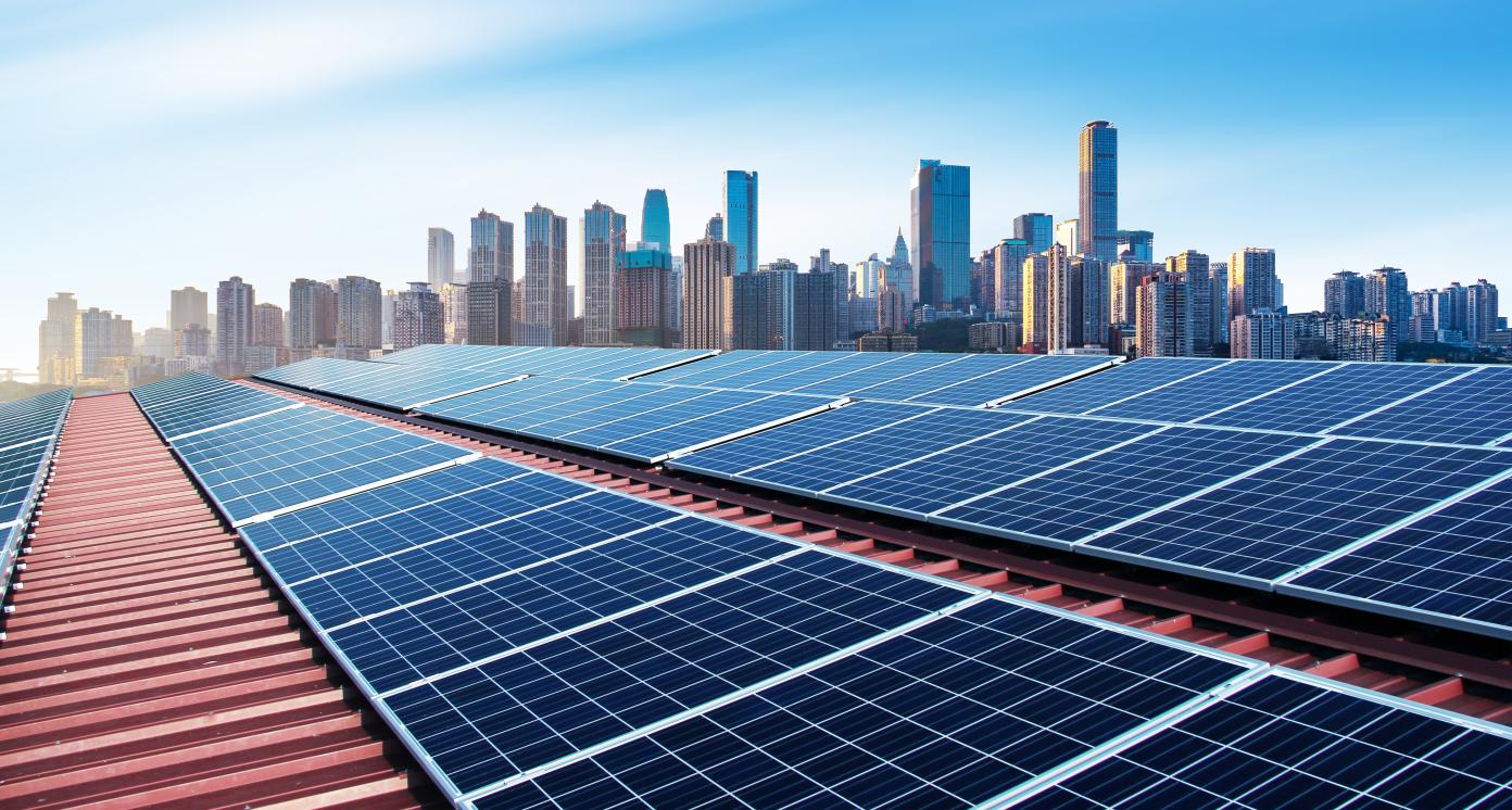 PV panels with a modern city skyline in background