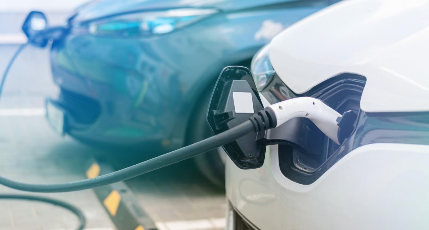 Plugged cars charging in a station