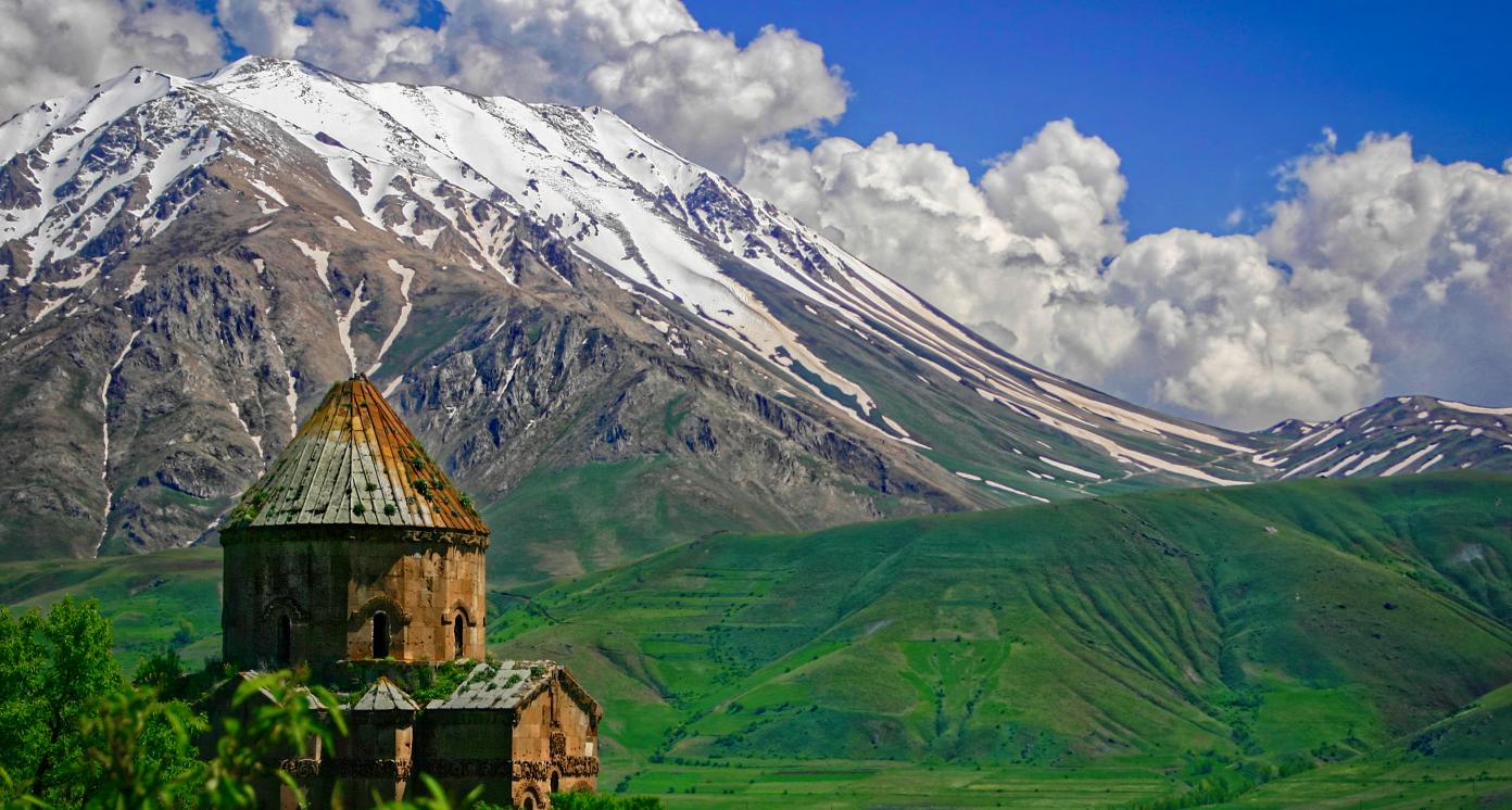 The christian church on the Akdamar-Island with snowy mountains in the background in springtime