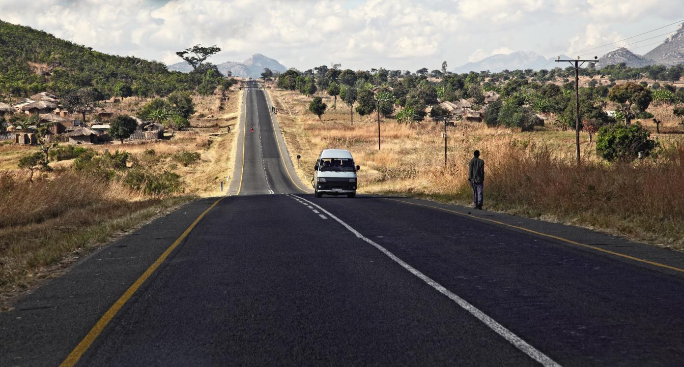 road of malawi with people and cars