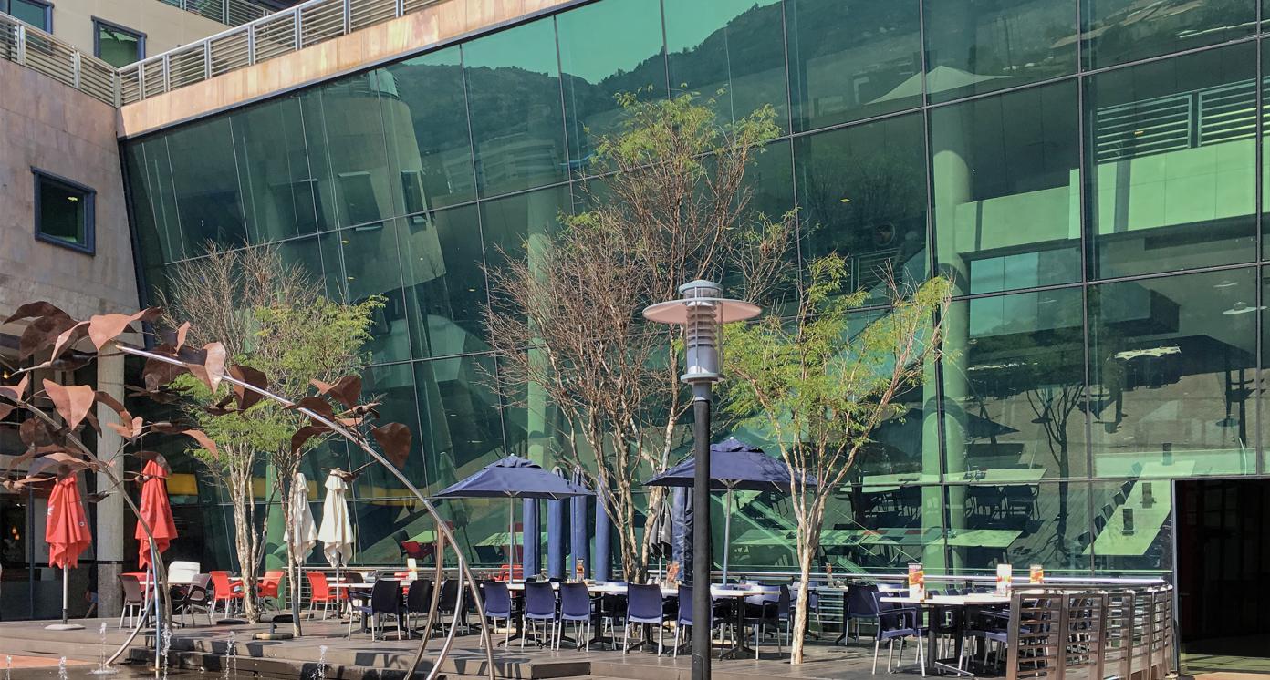 Eswatini (Swaziland) - Mbabane - The empty open-air foodcourt in abstract shopping center illustrating covid-19 lockdown measures