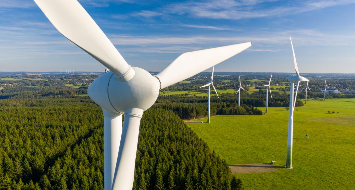 Electric windmills on field