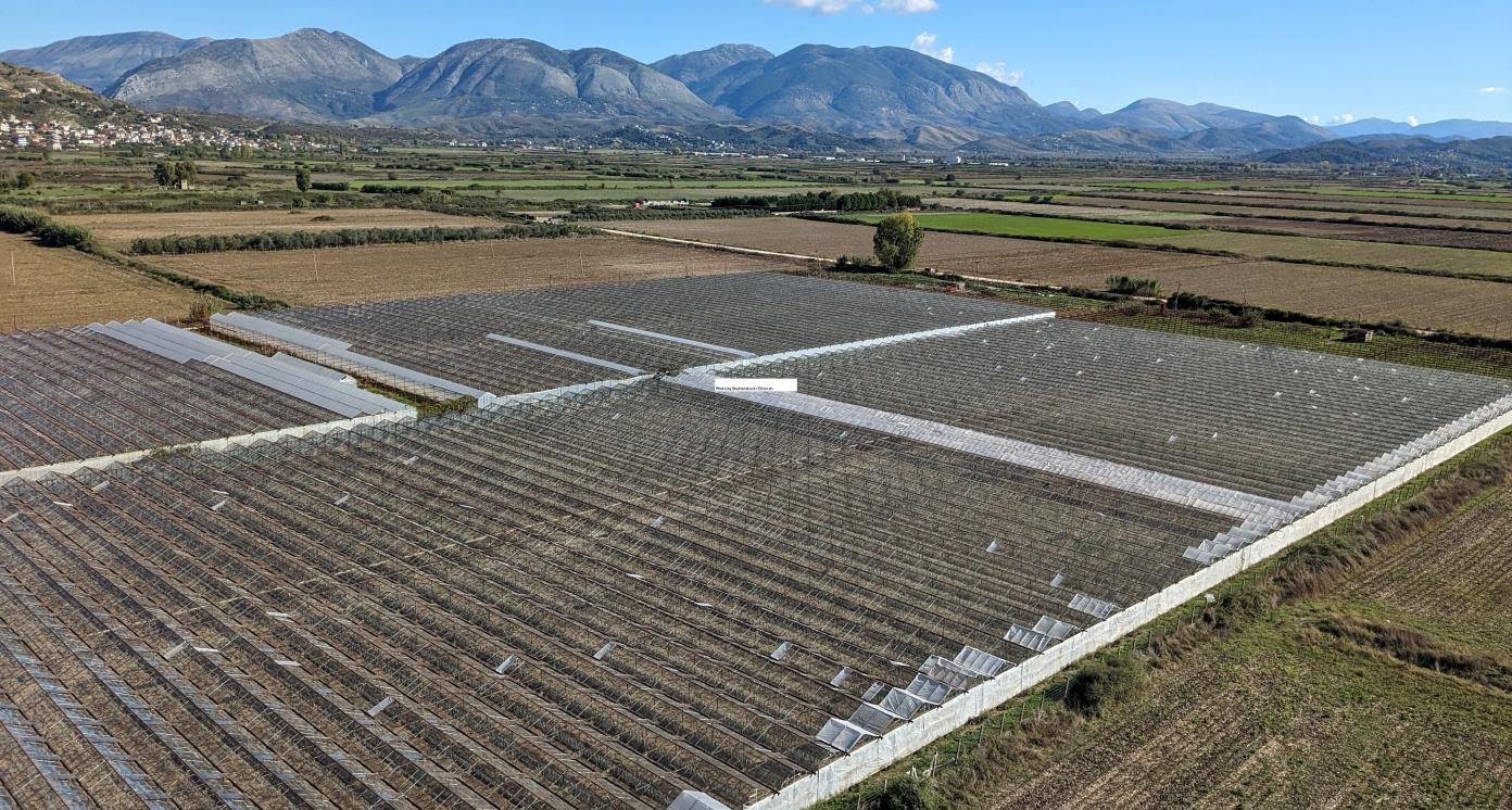 "greenhouses under the mountains in Sarande region of Albania,Balkan, aerial panorama landscape view "