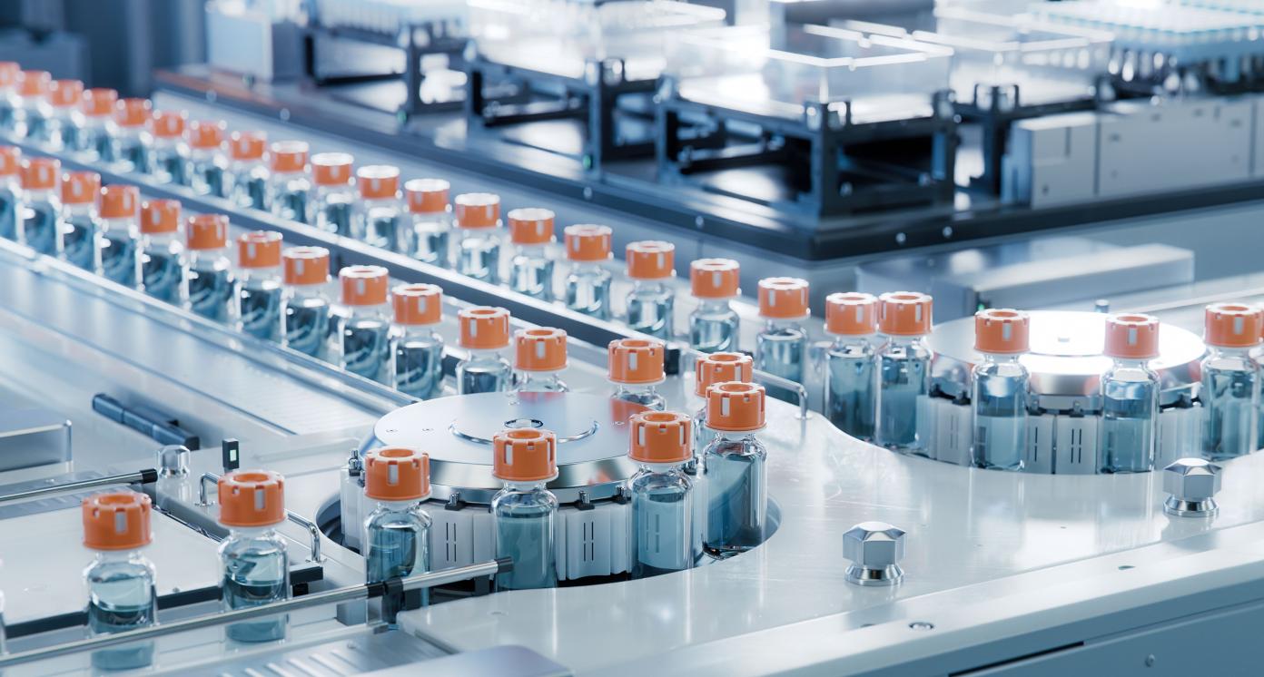 Vaccine Production Facility. Medication Manufacturing Process. Glass Vials with Orange Caps on Conveyor Belt. Medical Ampoule Production Line at Modern Pharmaceutical Factory.