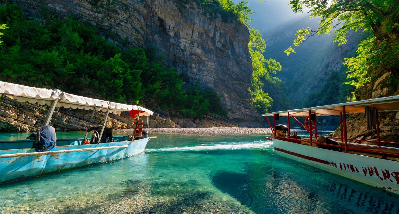 Shala river scenery with steep mountains and lush forests in northern Albania.