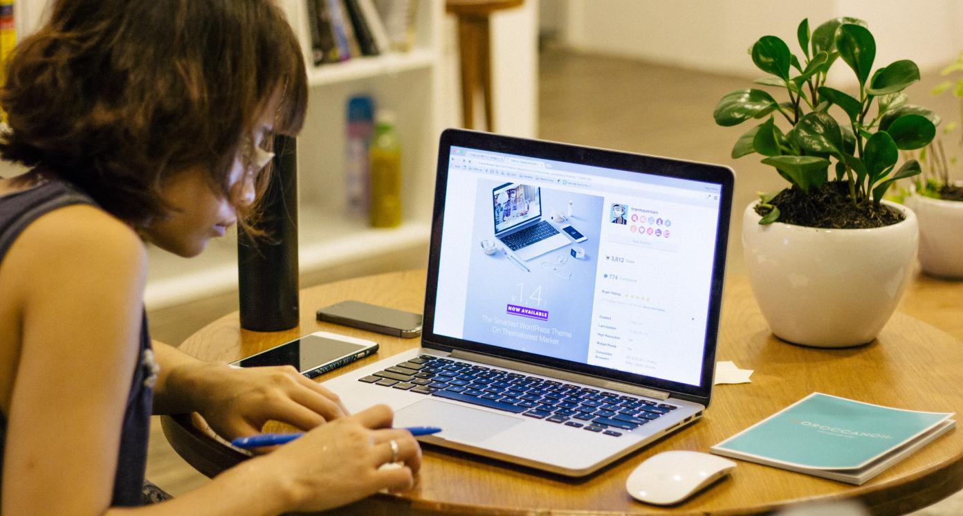 Woman browsing on her laptop