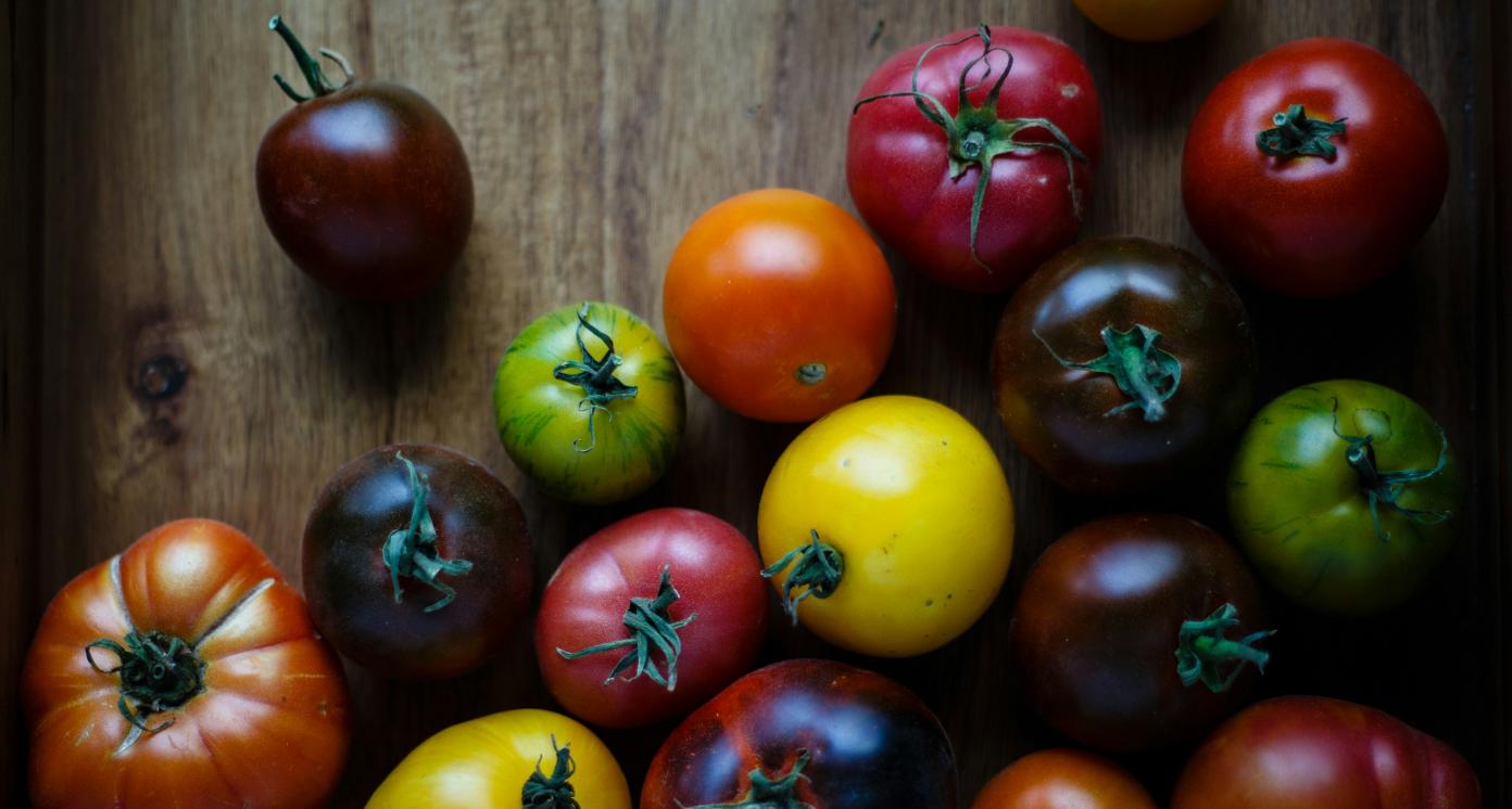 Variety of tomatoes laid on a table