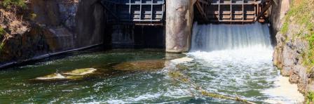 Open sluice gates of a small dam