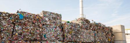 Waste-to-energy or energy-from-waste is the process of generating energy in the form of electricity or heat from the primary treatment of waste. Cubes of pressed metal beer and soda cans.