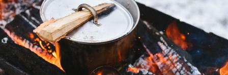 Silver cook pot on a stove