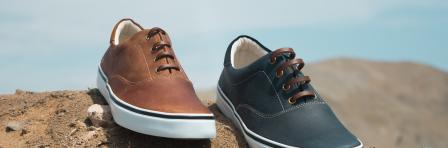 Unmatched pair of brown and blue sneakers