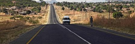 road of malawi with people and cars