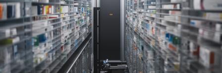 Narrow pharmacy aisle flanked by towering shelves stocked with medicine boxes. A pharmacy robot navigates through, ensuring efficient and precise medication retrieval.