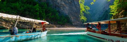 Shala river scenery with steep mountains and lush forests in northern Albania.