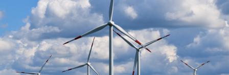 wind turbines on green grass fields