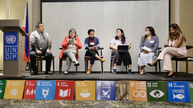 Panelists speak at a discussion forum held in Makati City, the Philippines, on 11 November 2024. 